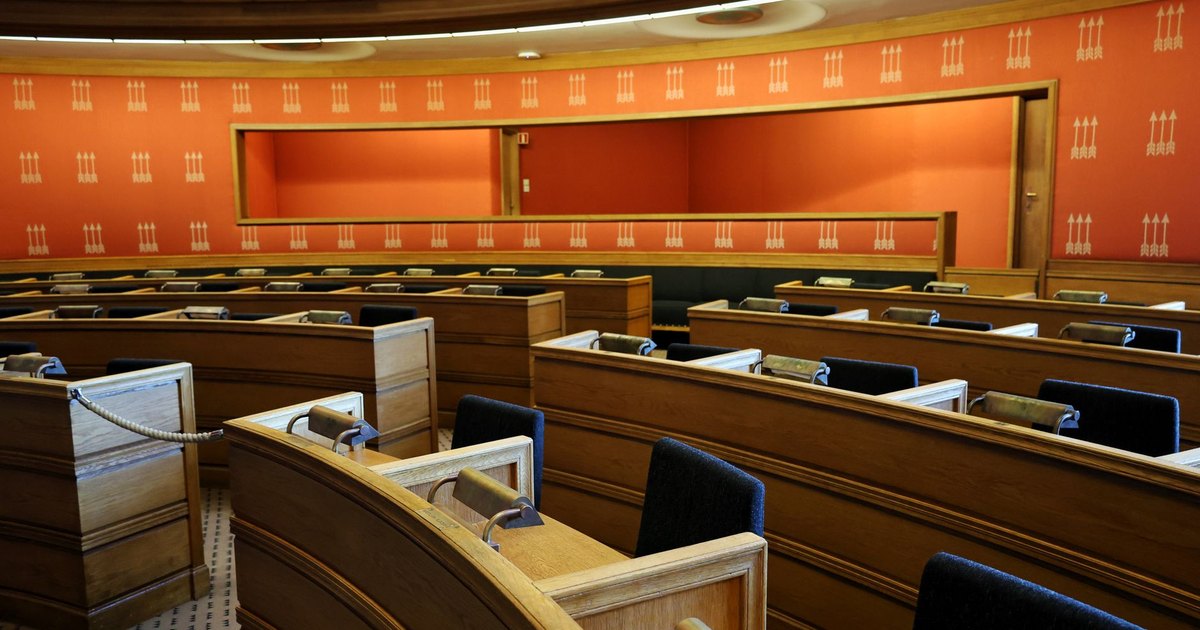 Empty wooden benches inside a courtroom