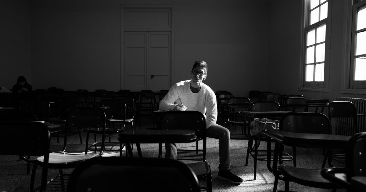 A smartphone screen glowing in a dark room