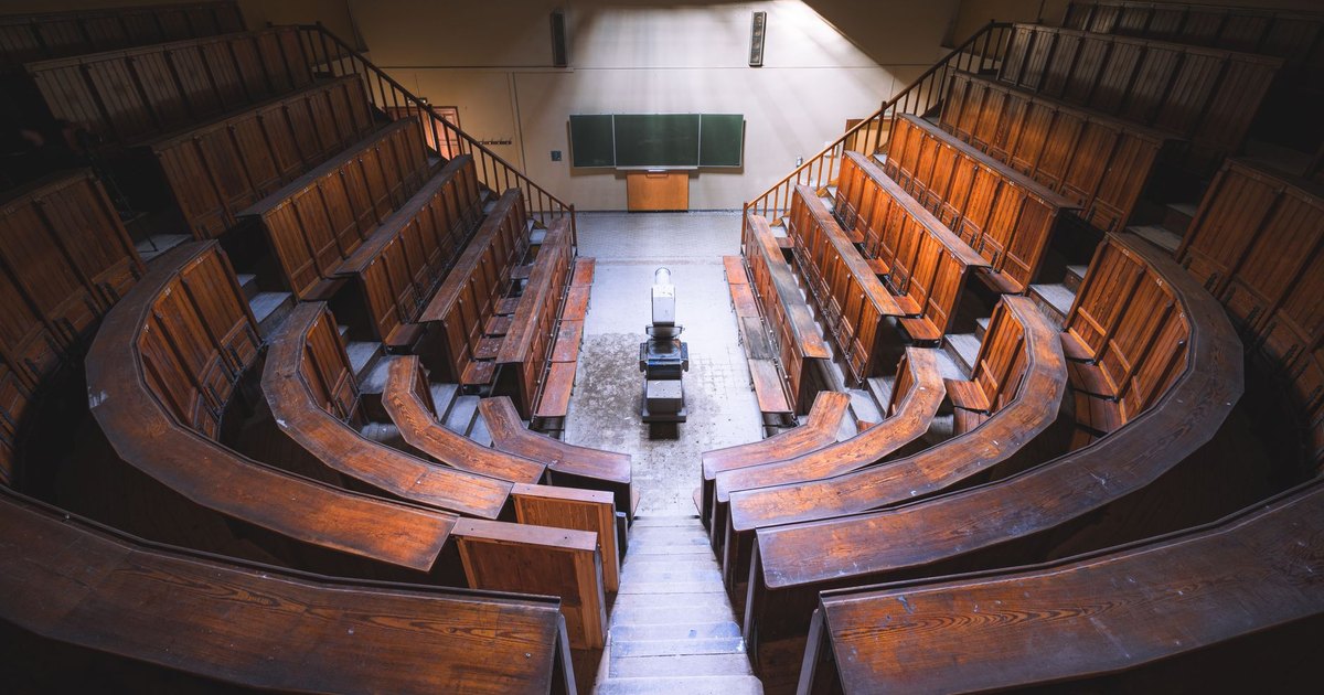 The empty benches of a courtroom