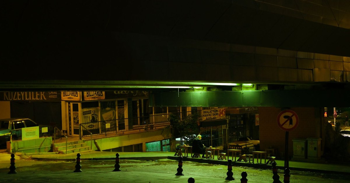 A smartphone showing a social media app in dim light