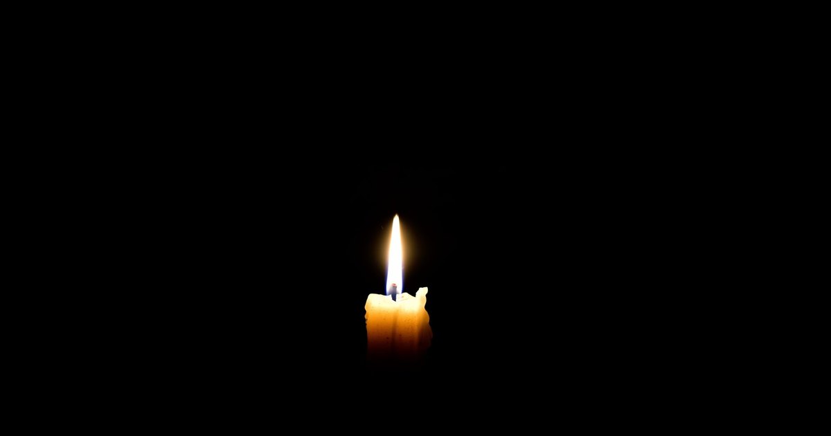 A smartphone screen glowing in the dark