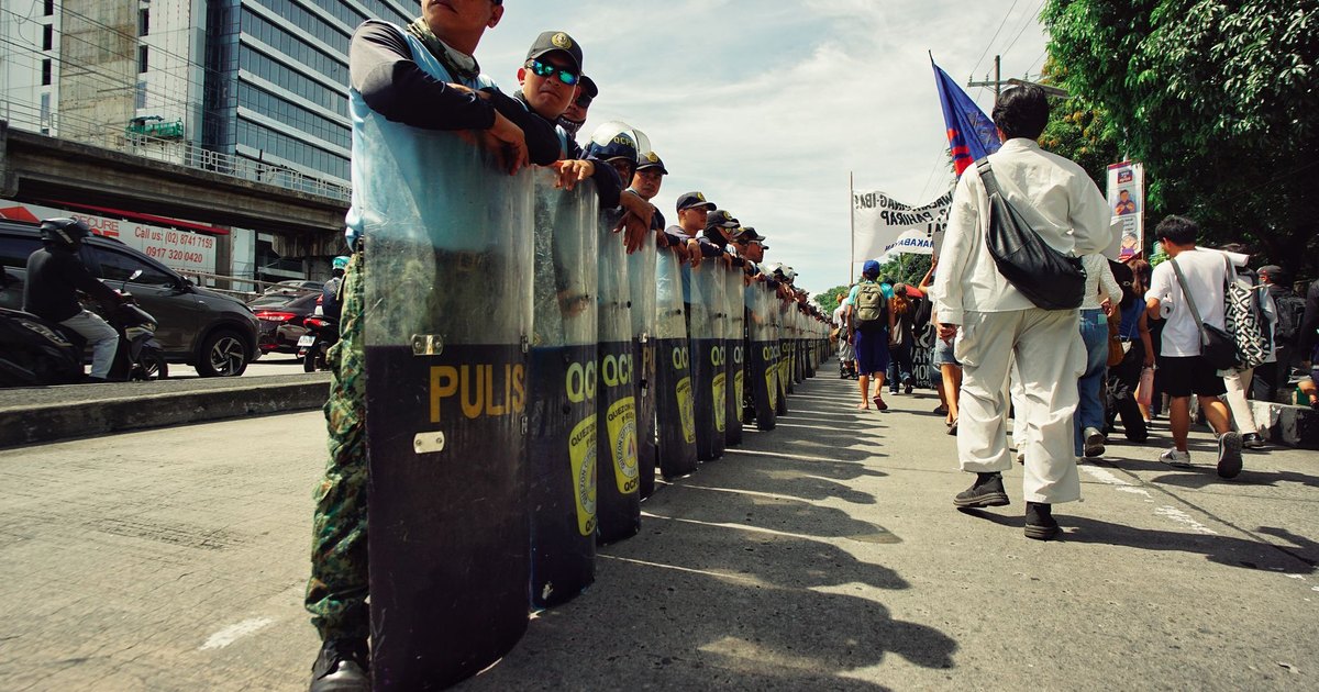 Riot police on a street during unrest