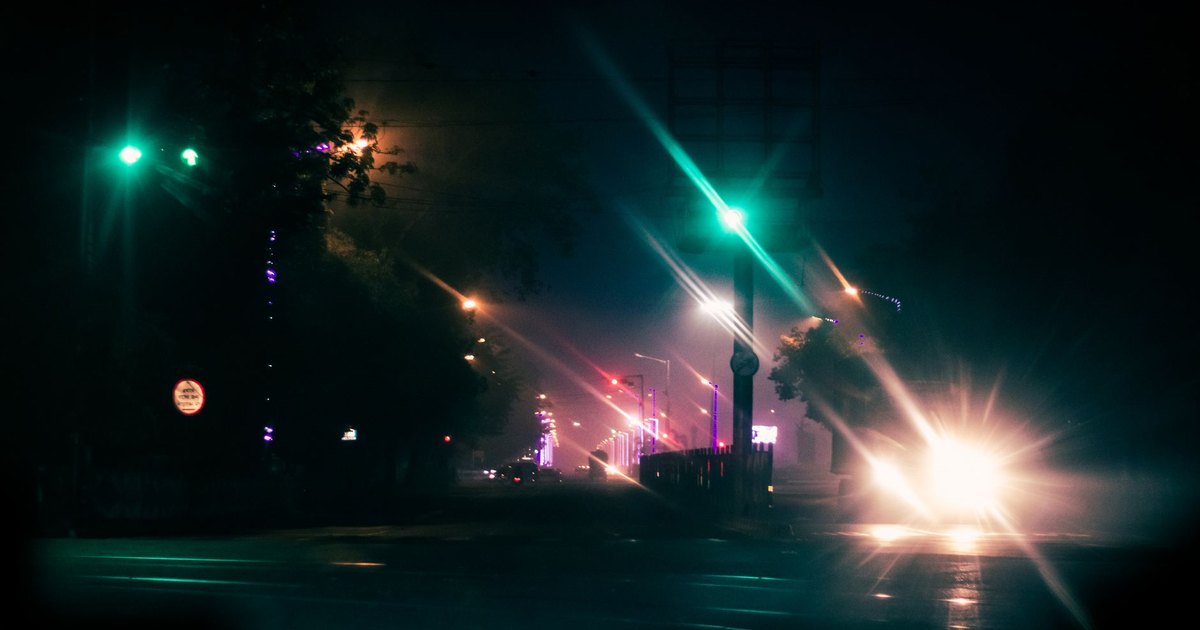 A messaging app glowing on a smartphone screen in the dark