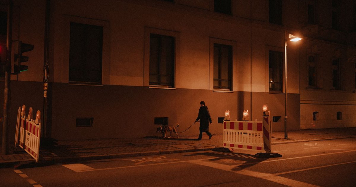 A smartphone displaying social media apps in dim light